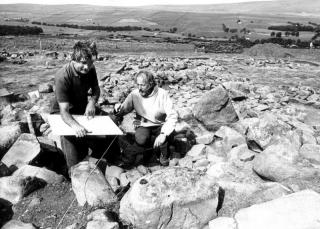 Directors of excavation checking the plan