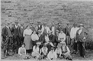 Men, women and children at Rookhope smelt mill. Beamish Museum: Photograph courtesy of Beamish, The North of England Open Air Museum