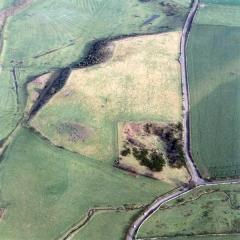 aerial photograph of Yeavering and the quarry, which nearly destroyed it. Courtesy of Air Fotos